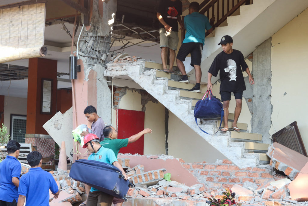 Magnitude 7.7 earthquake off Indonesia's coast causes casualties and building damage