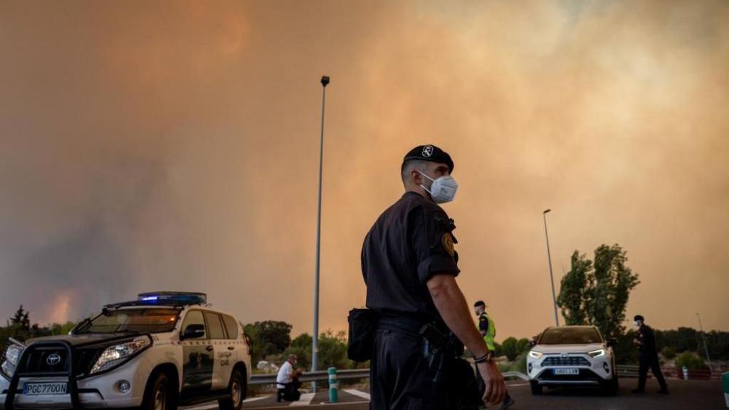 Firefighters work to control wildfires in Madrid and southern France