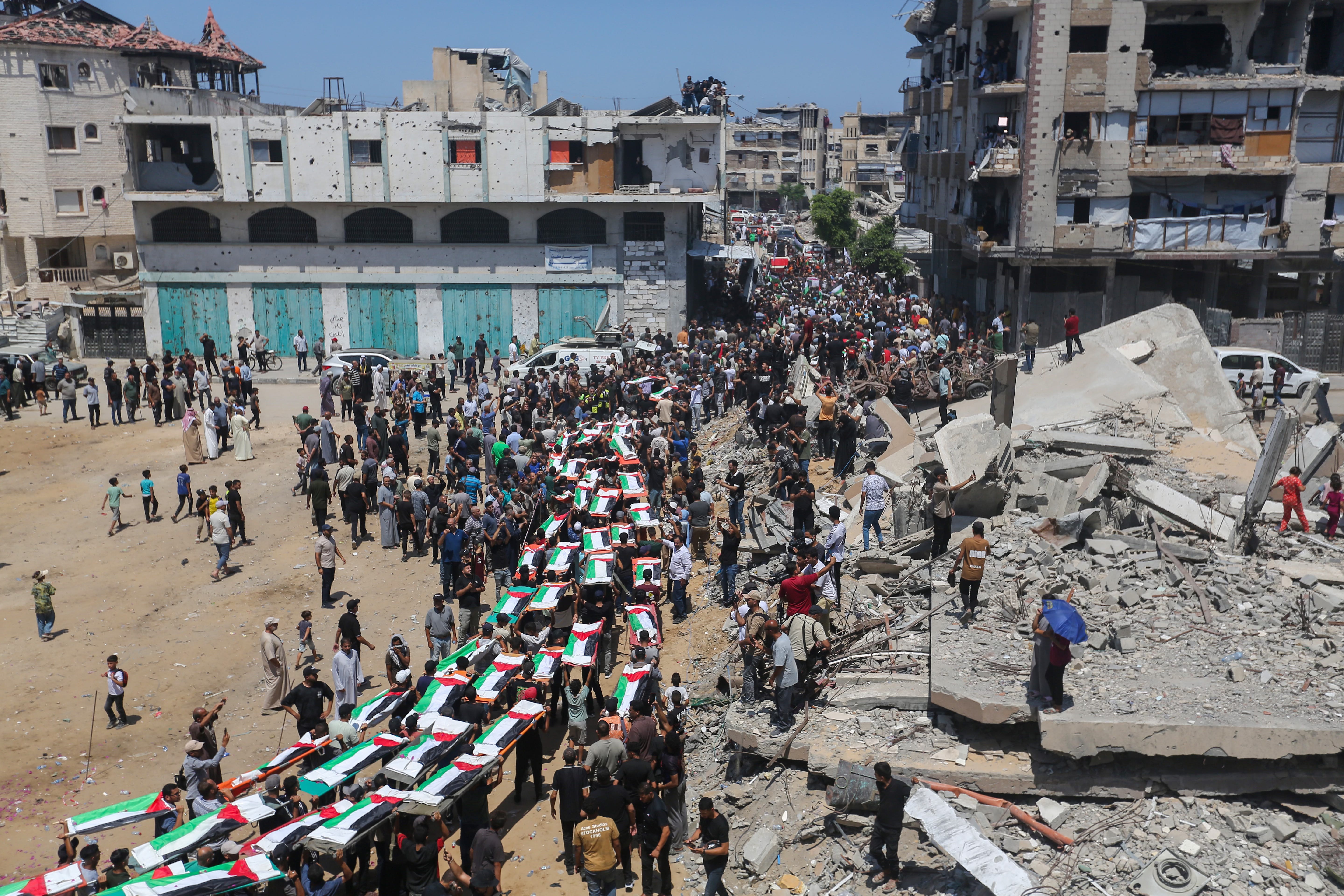 U.S. Gathers Public Input on Iran Policy; Mass Funeral in Gaza for 112 Casualties